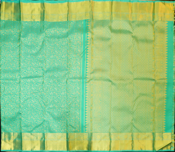 Close view of premium bridal kanchipuram silk saree in anandha colour with folral zari jaal