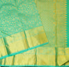 Close view of premium bridal kanchipuram silk saree in anandha colour with folral zari jaal