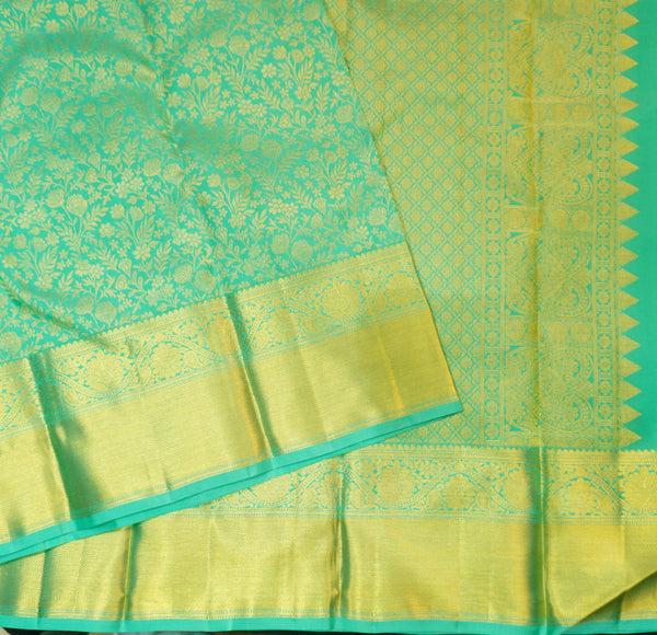 Close view of premium bridal kanchipuram silk saree in anandha colour with folral zari jaal