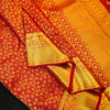 Close view of premium bridal kanchipuram silk saree in bridal red colour with creeping floral design