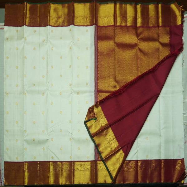 Half White Korvai Kanchipuram Silk Saree with Chakaram Butta and Maroon Border