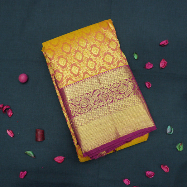 Sunset Orange Kanchipuram Silk Saree with Magenta Korvai Border
