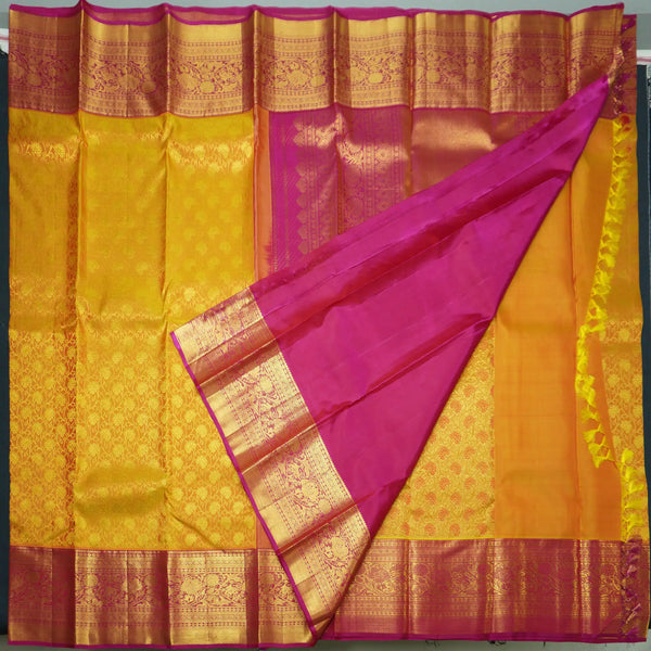 Sunset Orange Kanchipuram Silk Saree with Magenta Korvai Border
