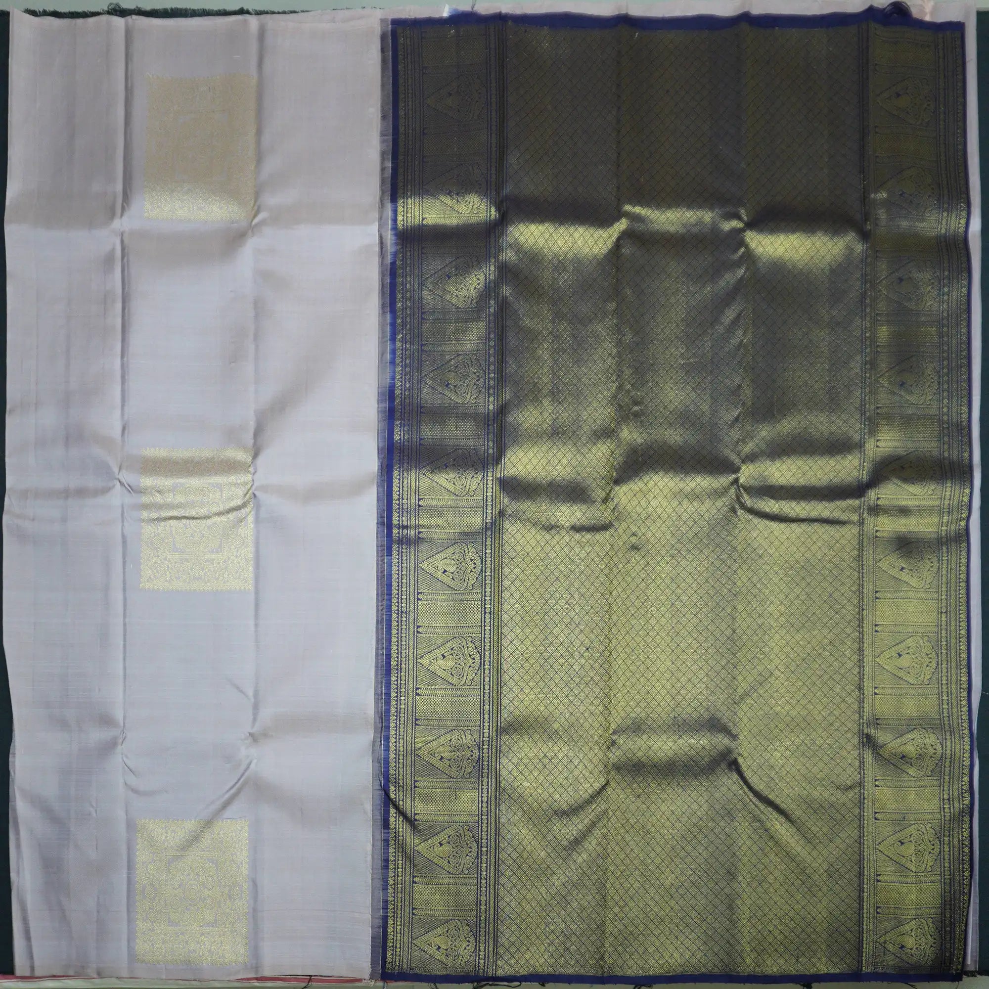 Silver Gray Borderless Kanchipuram Silk Saree with Fancy Butta & Blue Pallu
