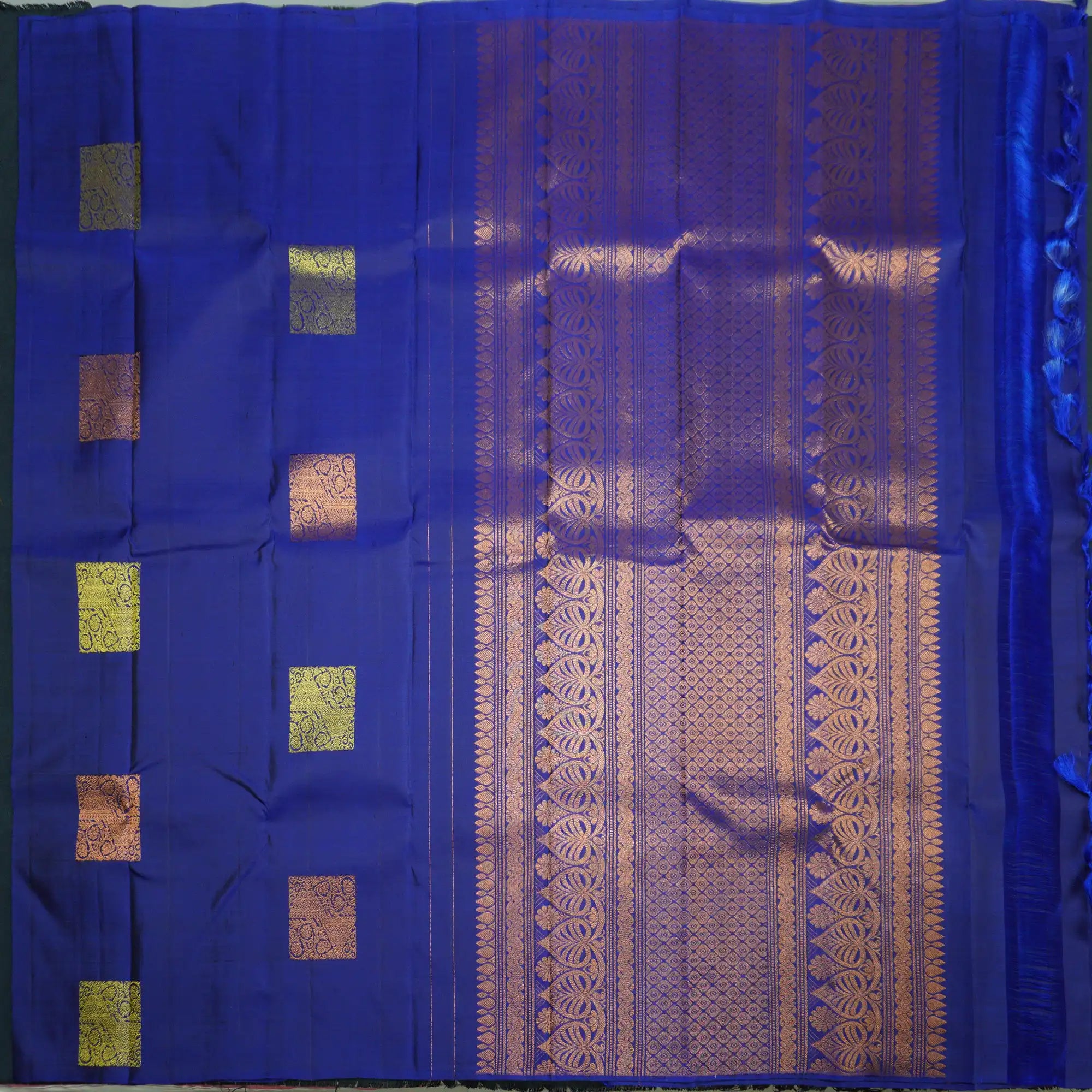 Deep Blue Borderless Kanchipuram Silk Saree with Gold and Copper Motifs
