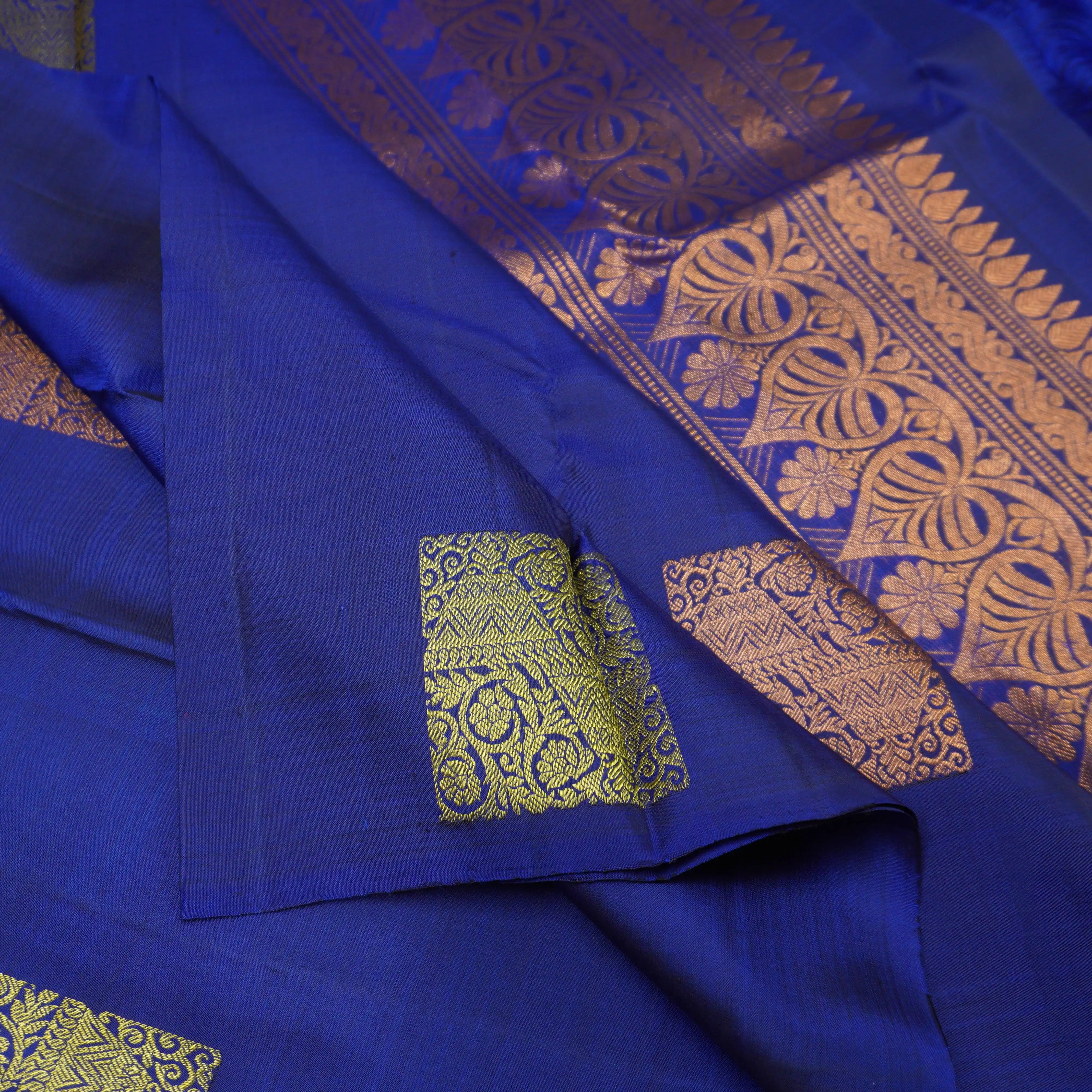 Deep Blue Borderless Kanchipuram Silk Saree with Gold and Copper Motifs
