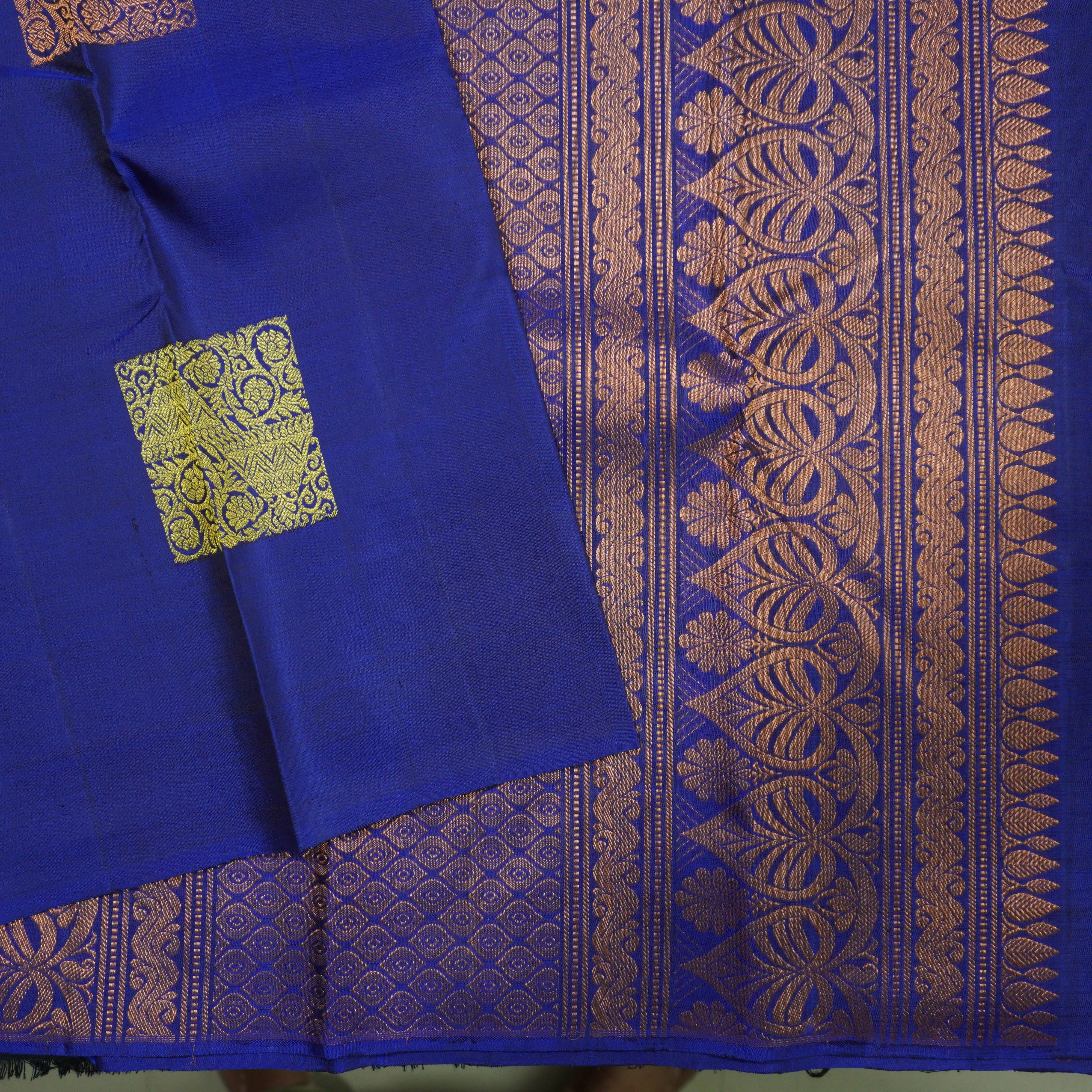 Deep Blue Borderless Kanchipuram Silk Saree with Gold and Copper Motifs
