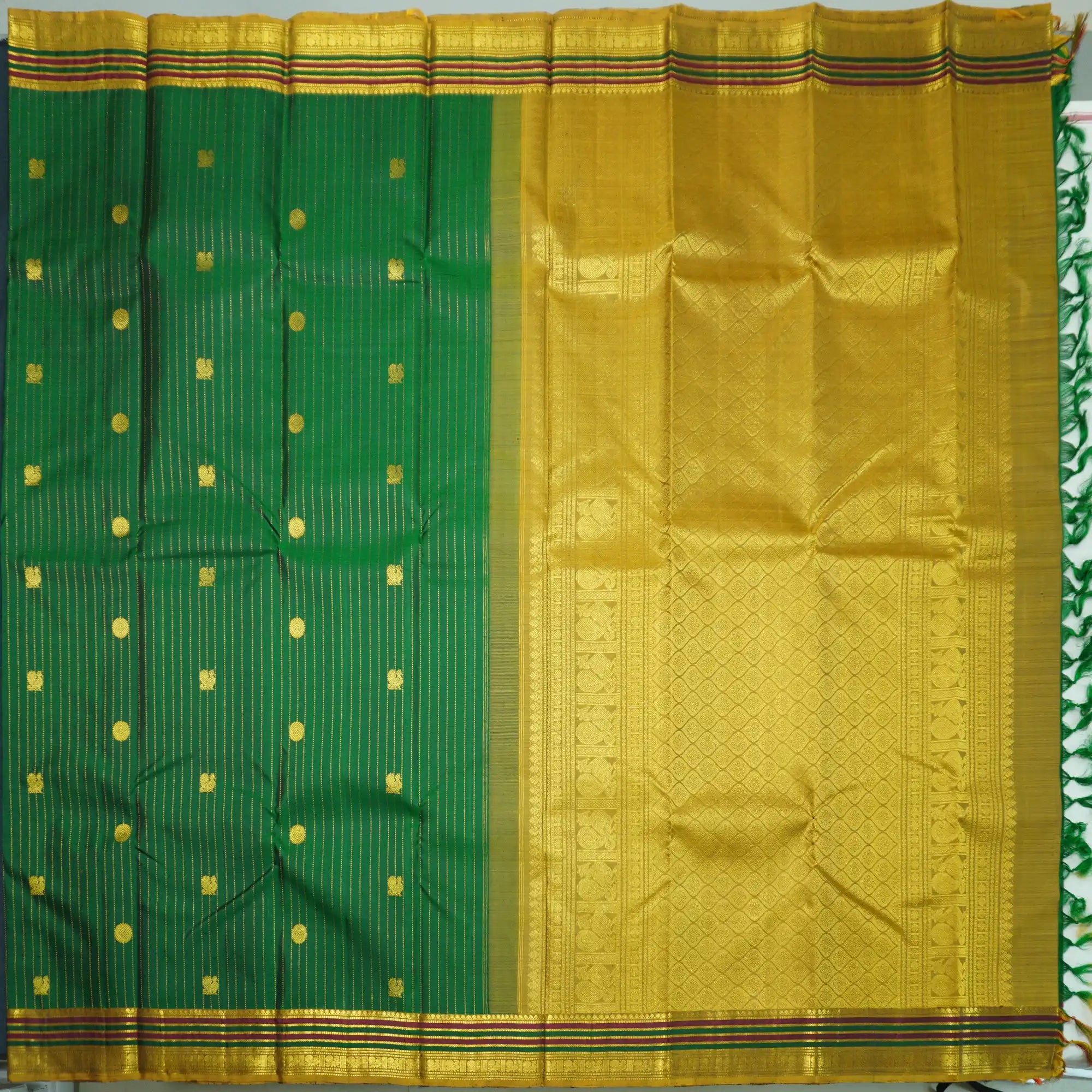 Green Kanchipuram Silk Saree with Zari Butta and Multi-Color Threadwork Border