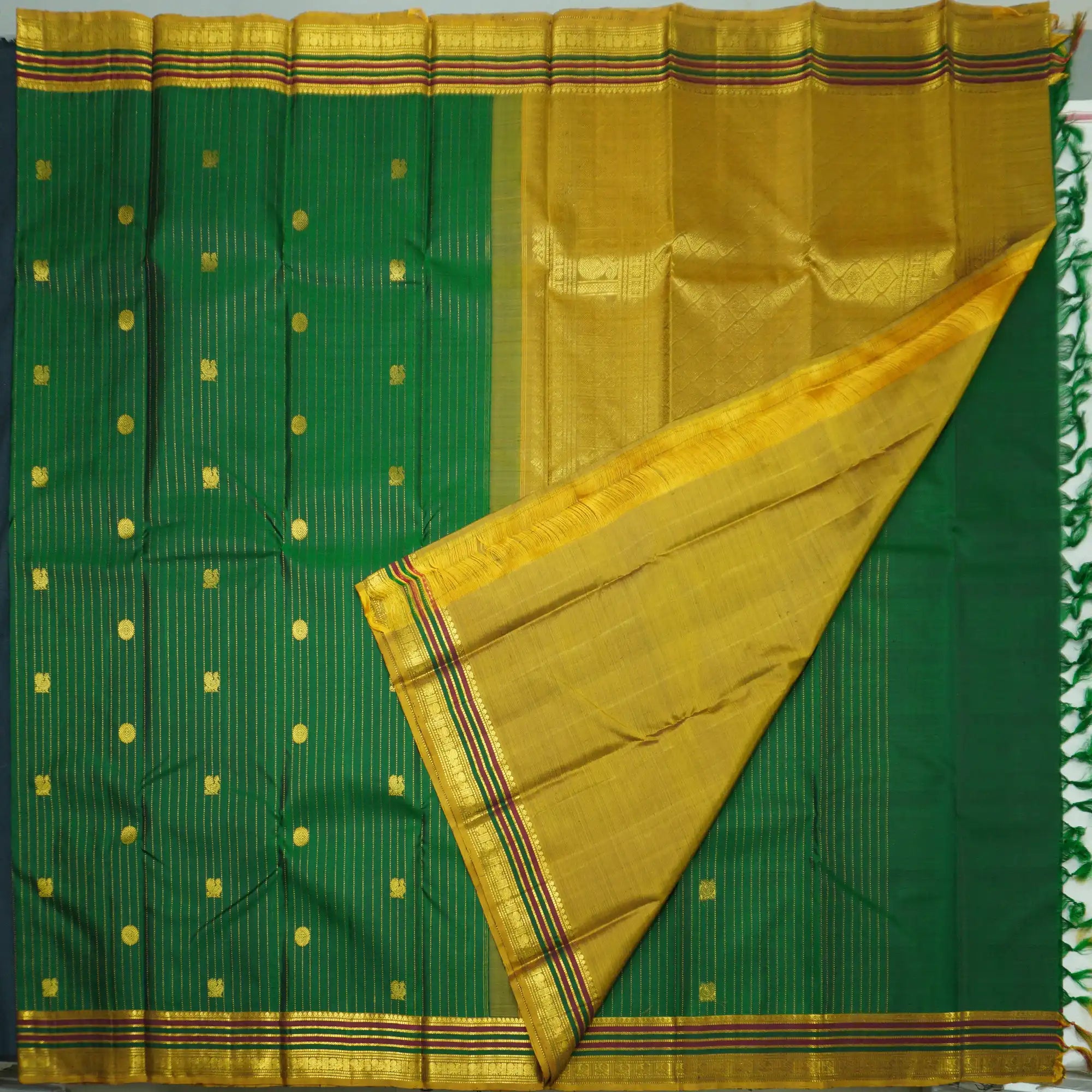 Green Kanchipuram Silk Saree with Zari Butta and Multi-Color Threadwork Border