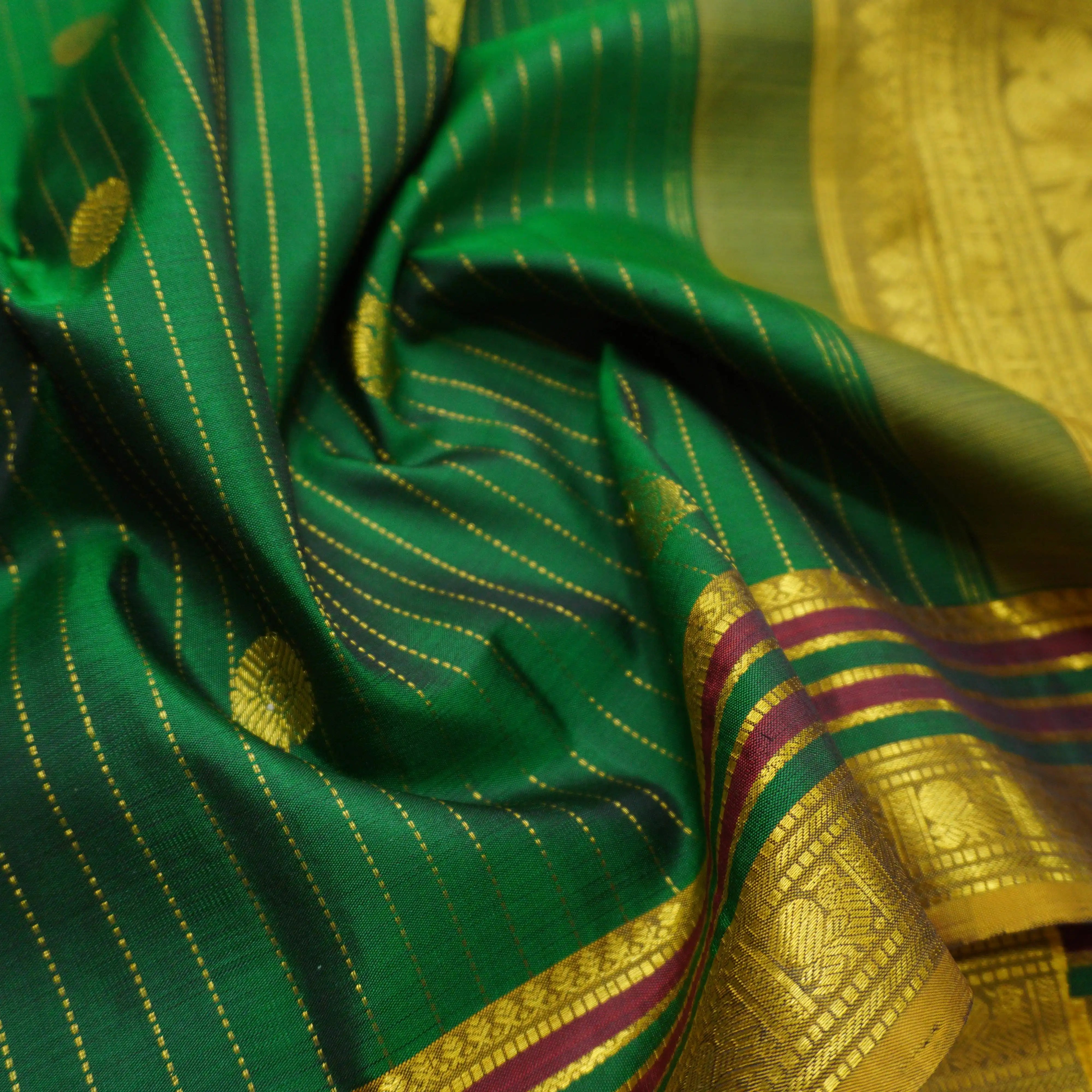 Green Kanchipuram Silk Saree with Zari Butta and Multi-Color Threadwork Border