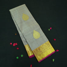 Load image into Gallery viewer, Elephant gray Kanchipuram silk saree with magenta border, gold thilagam motifs on the body, and rich zari pallu – traditional wedding saree from Vivaaha Silks.
