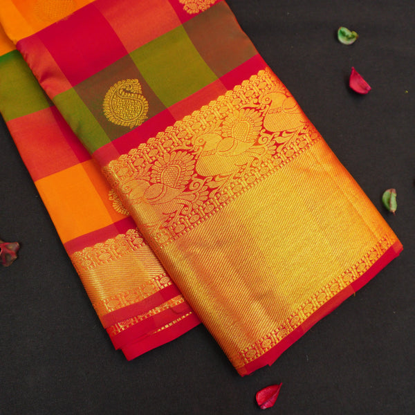 Classic Palum Pazham Kattam Kanchipuram silk saree from Vivaaha Silks with mango and thilagam butta, annam motif border, and rich red zari pallu.