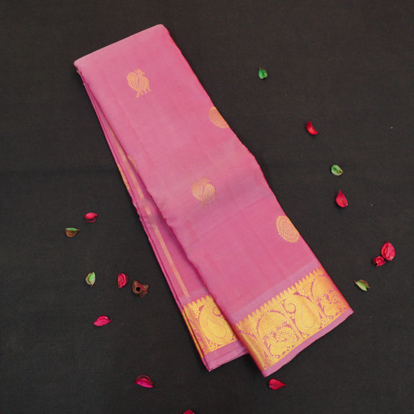 Baby pink Kanchipuram silk saree from Vivaaha Silks budget collection with golden annam and chakaram butta, rich zari pallu and traditional border.
