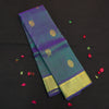 Peacock blue Kanchipuram silk saree from Vivaaha Silks budget collection featuring gold annam and chakaram butta, and a grand zari pallu with paisley and diamond motifs.