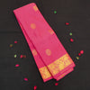 Peach pink Kanchipuram silk saree with gold annam and chakaram butta motifs, rich zari pallu, and traditional temple border – perfect for bridal and festive wear from Vivaaha Silks.