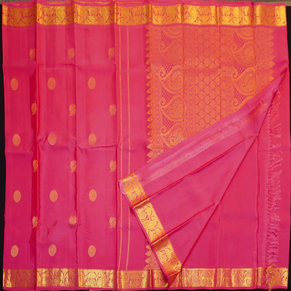 Peach pink Kanchipuram silk saree with gold annam and chakaram butta motifs, rich zari pallu, and traditional temple border – perfect for bridal and festive wear from Vivaaha Silks.