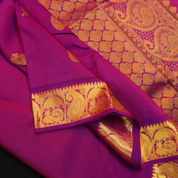 Vadamalli violet Kanchipuram silk saree from Vivaaha Silks budget collection featuring gold annam and chakaram butta with a rich traditional gold zari pallu.