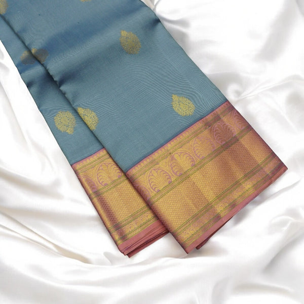 Pastel Blue Kanchipuram Silk Saree with Golden Korvai Border and Butta Design