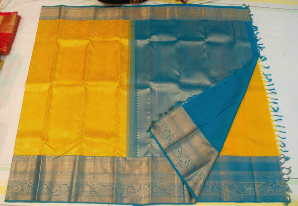 Yellow Bridal Kanchipuram Silk Saree with Teal Blue Korvai