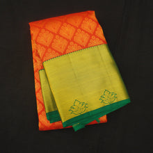 Load image into Gallery viewer, Orange Kanjivaram Bridal silk sari in Green Border, High Fancy Flower corsage butta handwoven in gold zari. Specially Customized for Bride to be!
