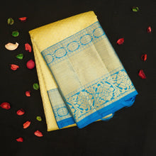 Load image into Gallery viewer, Lemon Yellow kanchipuram bridal silk saree with ananda border handwoven with pure gold zari 

