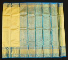 Load image into Gallery viewer, Lemon Yellow kanchipuram bridal silk saree with ananda border handwoven with pure gold zari 
